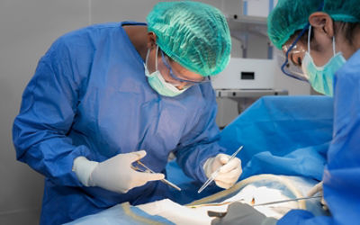 Surgeon operation on a patient 