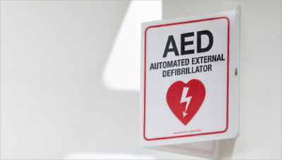 AED sign hanging on an office wall 