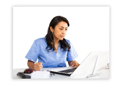 Female doctor in a white lab coat filling out credentialing paperwork