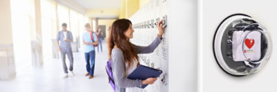 Student opening locker next to a LIFEPAK CR2 defibrillator 