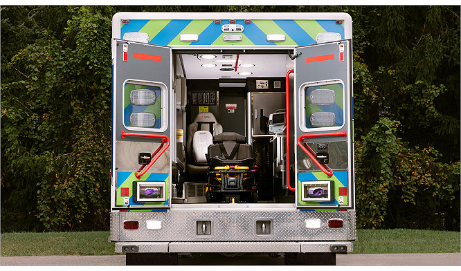 Back of an ambulance with a powered ambulance cot and LUCAS device 
