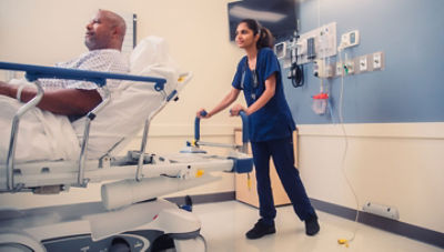 nurse pushing patient in prime series stretcher