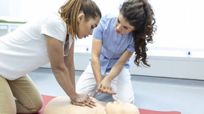 People learning CPR on a dummy