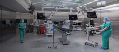 Nurses in operating room with modular stainless steel walls