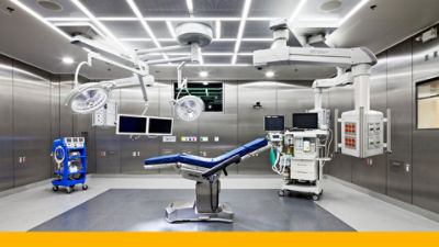 Operating room outfitted with Stryker equipment like an operating room table, lights and the Fortress modular wall system