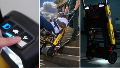 EMTs using the secure patient containment system on the motorized stair chair