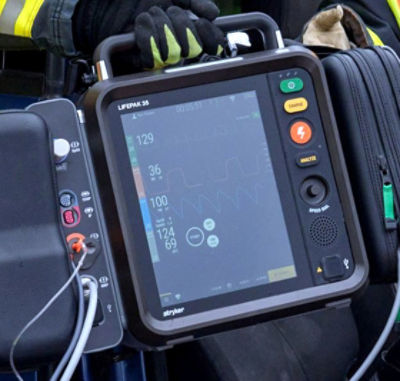 First responders passing LIFEPAK 35 through a car crash