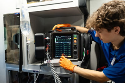 LIFEPAK 35 being utilized in the back of an ambulance by a paramedic