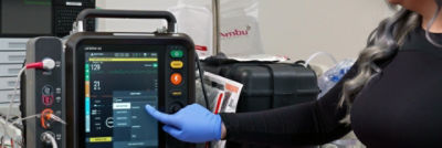 Nurse checking events on LIFEPAK 35 monitor/defibrillator touchscreen