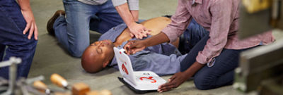 Bystander prepares LIFEPAK CR2 defibrillator for a sudden cardiac arrest victim