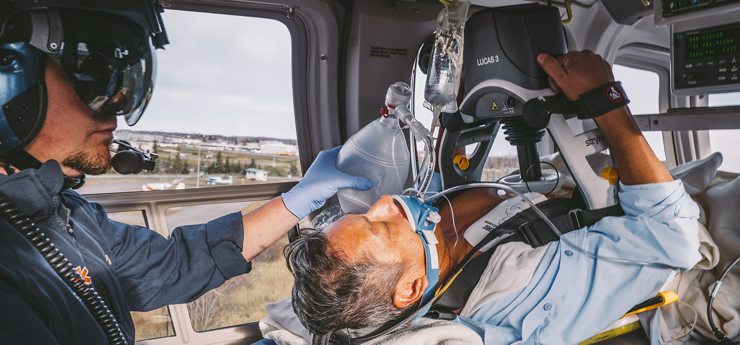 EMT performs CPR in a helicopter using the LUCAS 3, v3.1 chest compression system