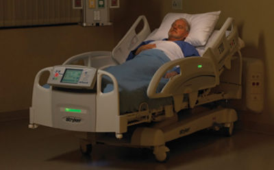 Patient lying in Stryker's InTouch critical care bed with iBed Awareness activated