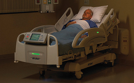 Patient lying in Stryker's InTouch Critical Care Bed with iBed Awareness activated