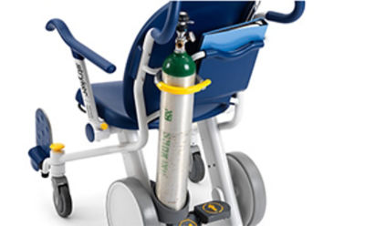 Upright oxygen bottle on the back of a Prime TC hospital transport chair 