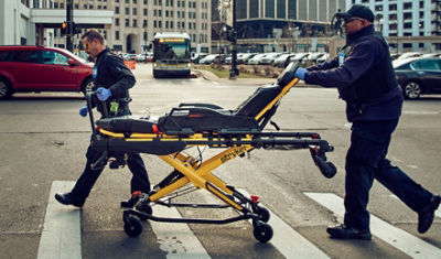 EMTs transporting a Power-PRO 2 powered amublance stretcher 