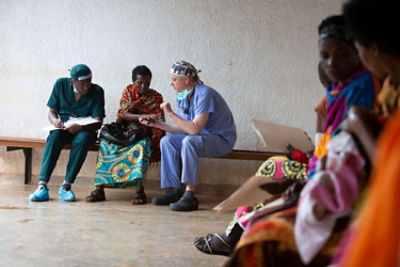 Dr. Steven Naum, a plastic surgeon, has been a volunteer surgeon for Operation Smile medical missions in Rwanda, Africa for many years. Here, Dr. Naum is examining a patient with University of Rwanda general surgery resident, Philemon. 