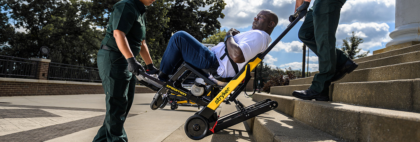 A patient being transported down stairs using the Xpedition powered stair chair