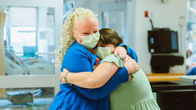nurse and patient embracing