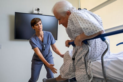 Nurse wearing Sync Badge responding to emergent situation