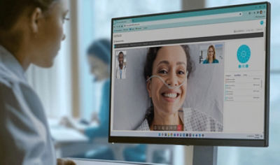 A nurse talking to a patient through the care.ai intelligence hub
