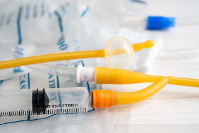 Syringes and other catheter insertion devices