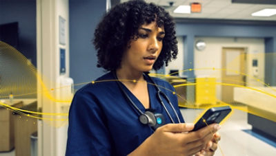 Healthcare professional accessing digital information in a care environment