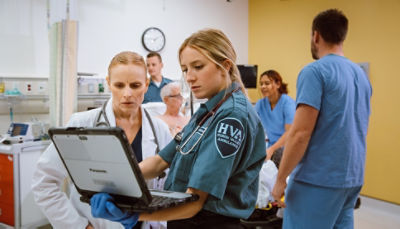 EMT and doctor reviewing LIFENET Care data in the emergency department 
