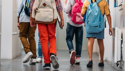 Students walking in school hallway