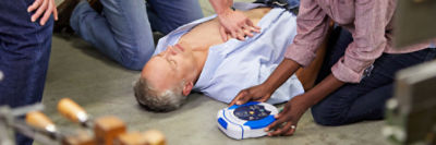 Bystander prepares HeartSine samaritan PAD 350P/360P AED for a sudden cardiac arrest victim