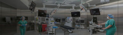 Healthcare professionals preparing an operating room for surgery