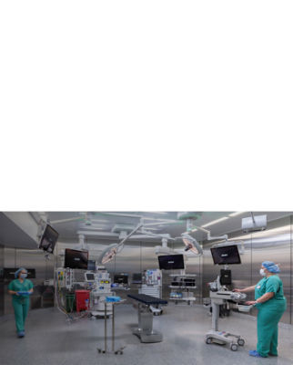 Healthcare professionals preparing an operating room for surgery