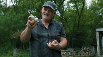 Denis Legault holding eggs