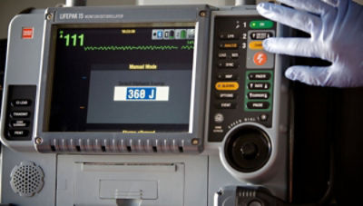 EMS professional operating the LIFEPAK 15 monitor/defibrillator