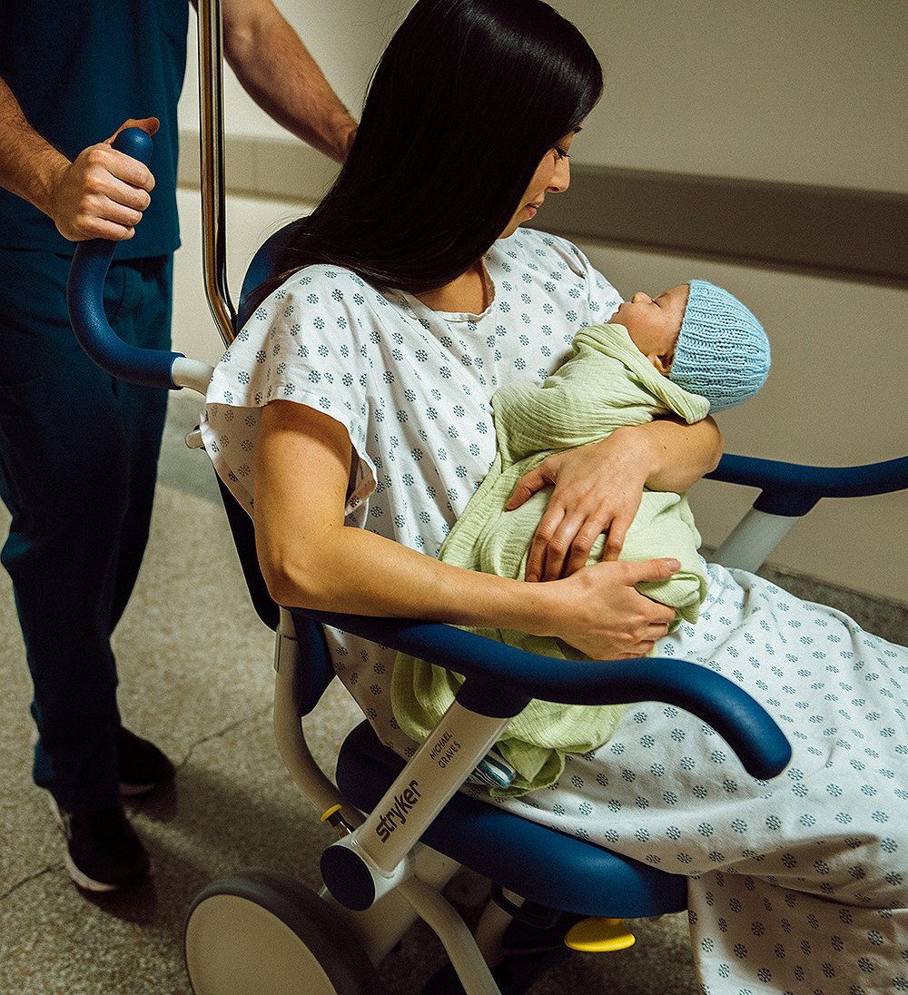 Mom holding newborn in the hospital 