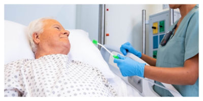 Nurse holding out an oral care toothbrush to help prevent hospital-acquired pneumonia