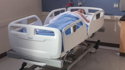 patient lying down in ProCeed hospital bed