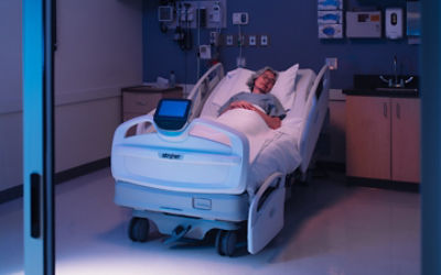 Patient laying in ProCuity hospital bed