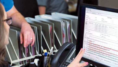 Healthcare professionals reviewing post-event data on Stryker's CODE-STAT data review software