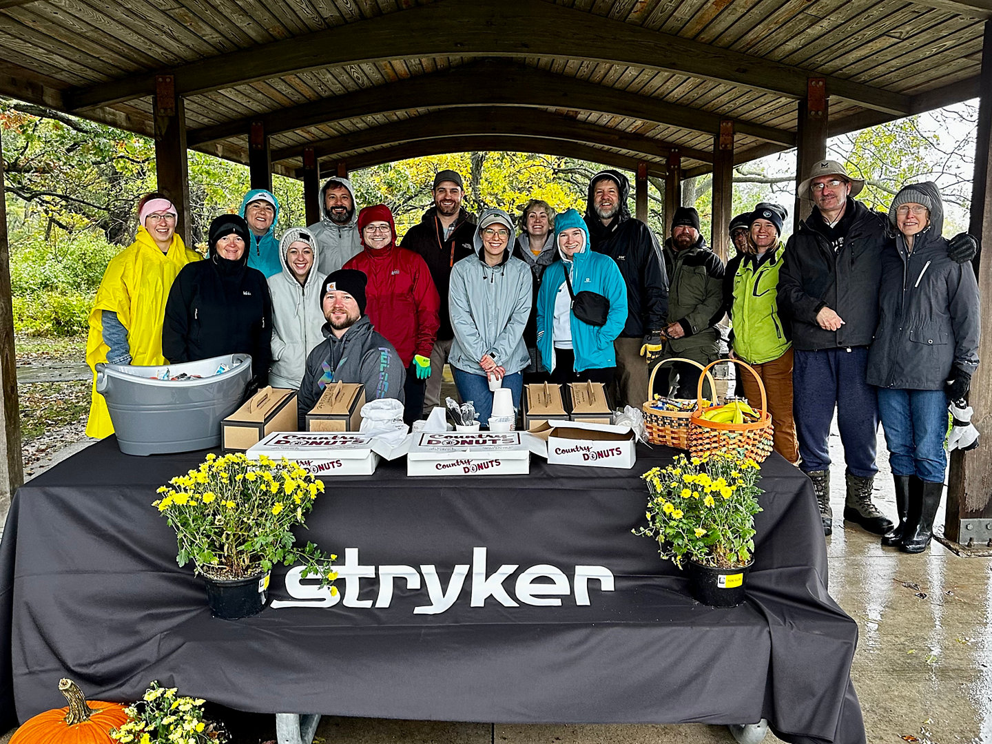 Stryker volunteers enjoying break from hard work and rain