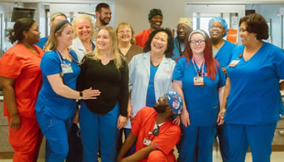 nurses and patient posing for photo