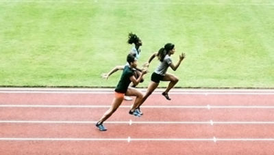 Student athletes running on a track