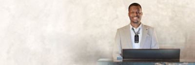 Hotel staff member wearing Vocera Smartbadge